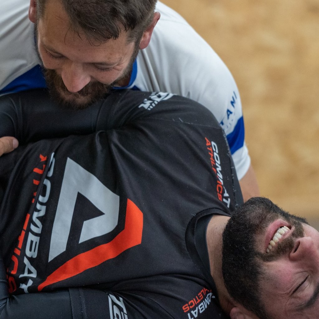 Two adult members practising Brazilian Jiu Jitsu at Two4 Martial Arts