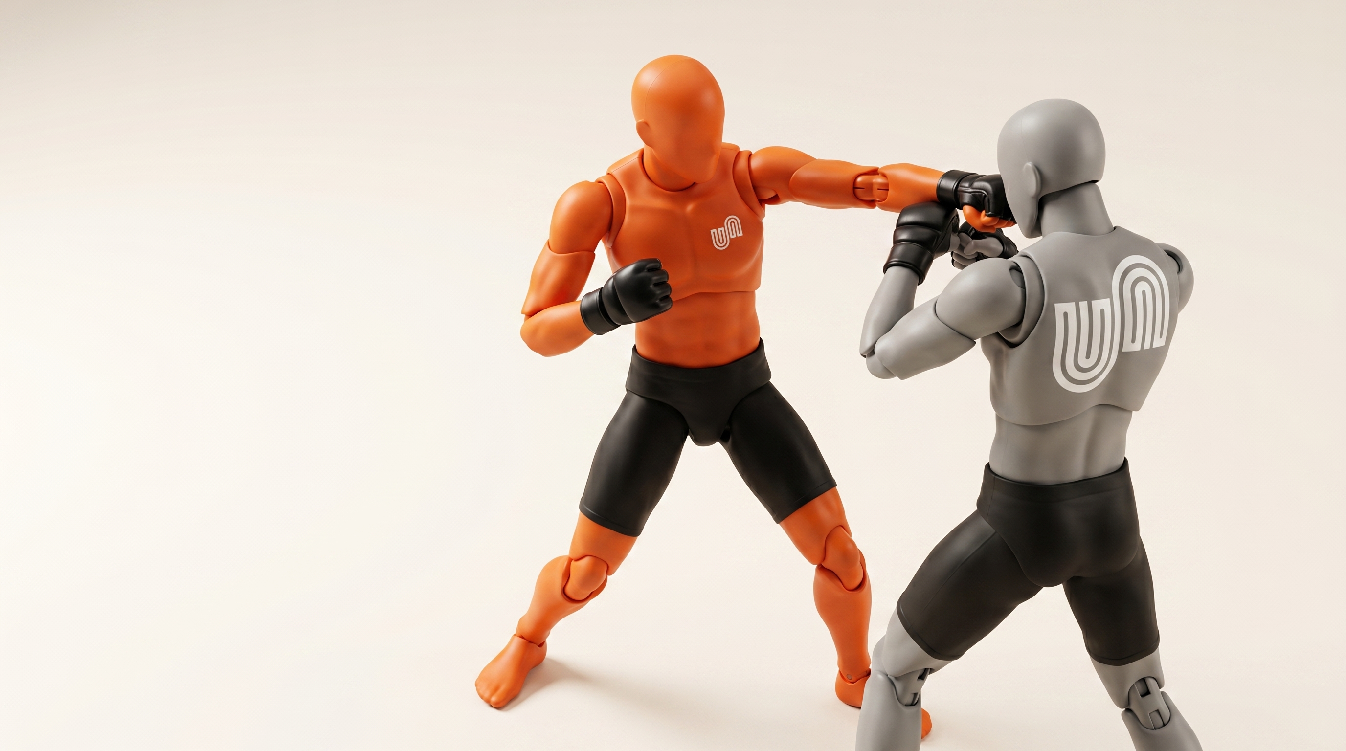 Two stylised training figures practising mixed martial arts