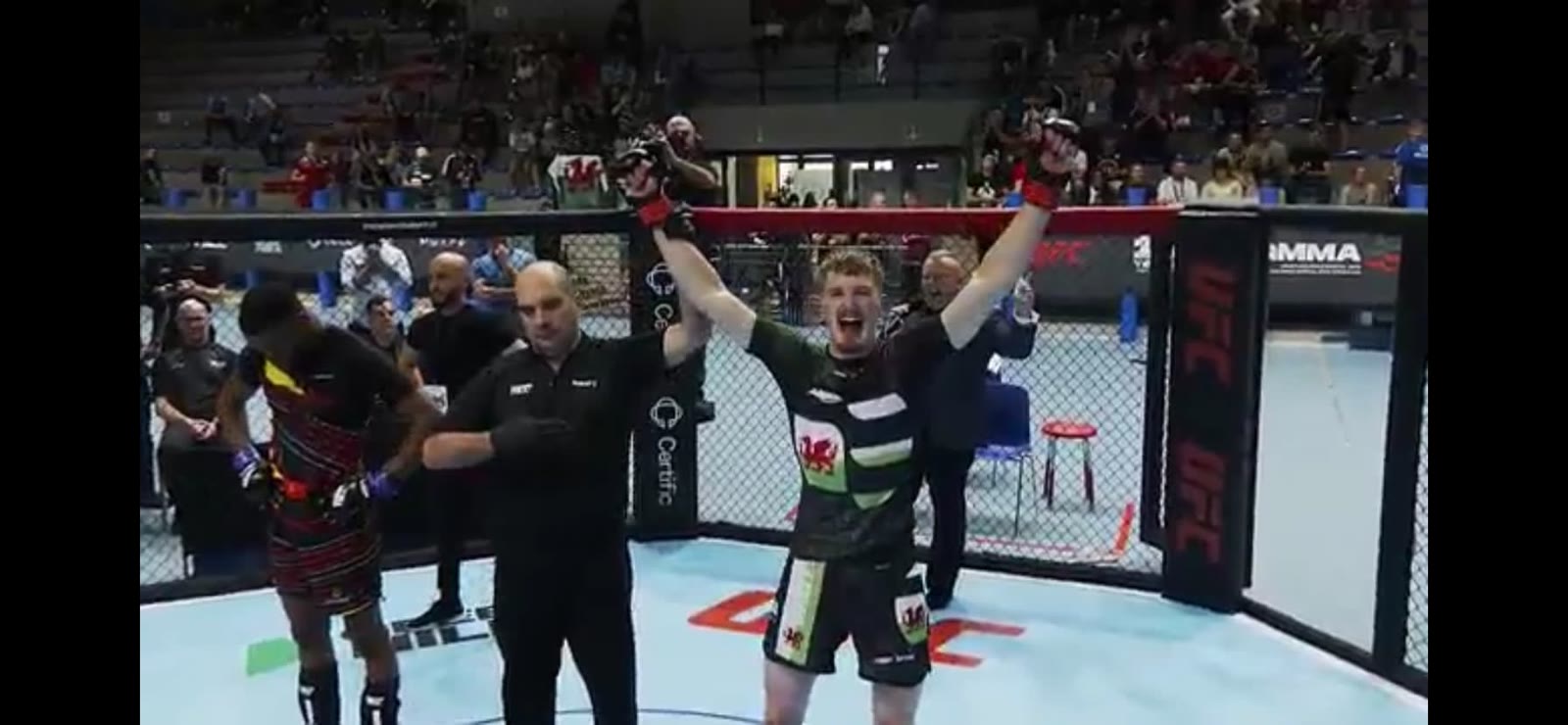 Ioan Harris celebrating inside the IMMAF cage after his European Championship victory