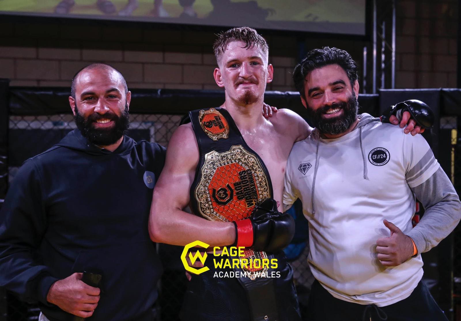 Josh O’Connor in the cage with two Two4 coaches after winning the Cage Warriors Academy Wales title
